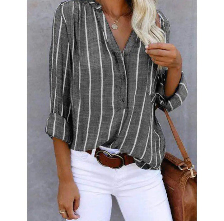 Striped women's summer blouse with a casual design, perfect for warm weather and versatile wear.