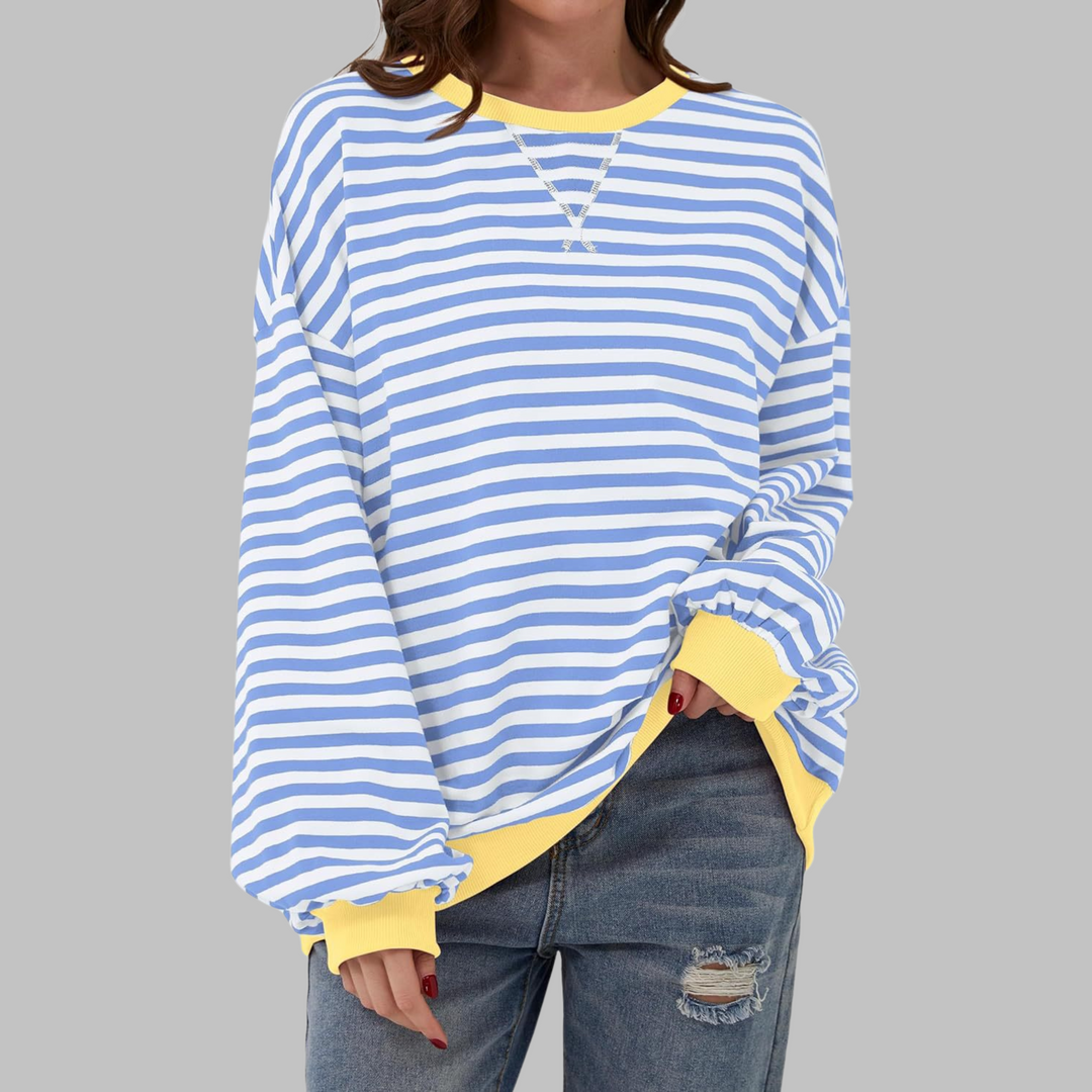 Fashionable women in a loose fit striped cotton blend crewneck jumper, perfect for casual wear.