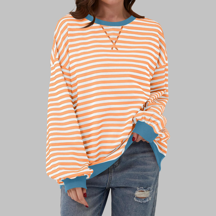 Women's casual striped sweater with a crewneck, made from a comfortable cotton blend in a loose fit.