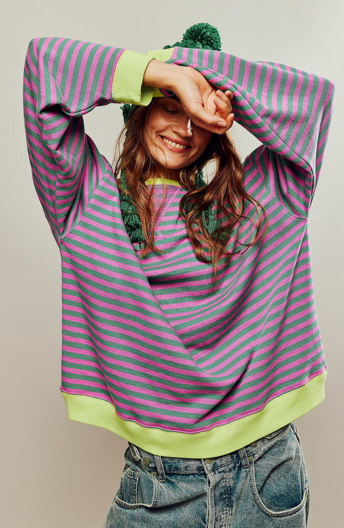 Women's striped crewneck sweater in pastel colors, perfect for spring casual wear.