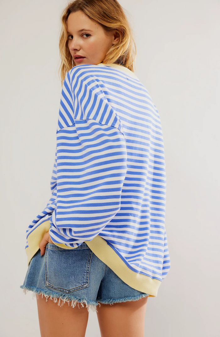 Soft women's striped crewneck sweater, perfect for layering or wearing on its own.