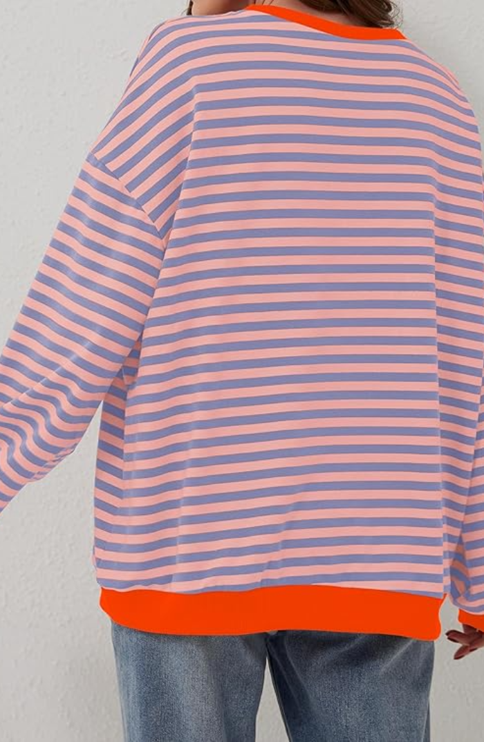 Women's long sleeve striped sweater with a crewneck, offering warmth and style.
