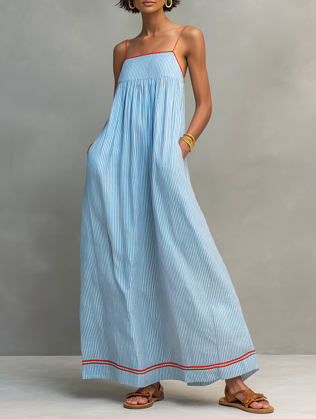 Women's striped maxi dress with spaghetti straps, perfect for summer casual wear and spring fashion.
