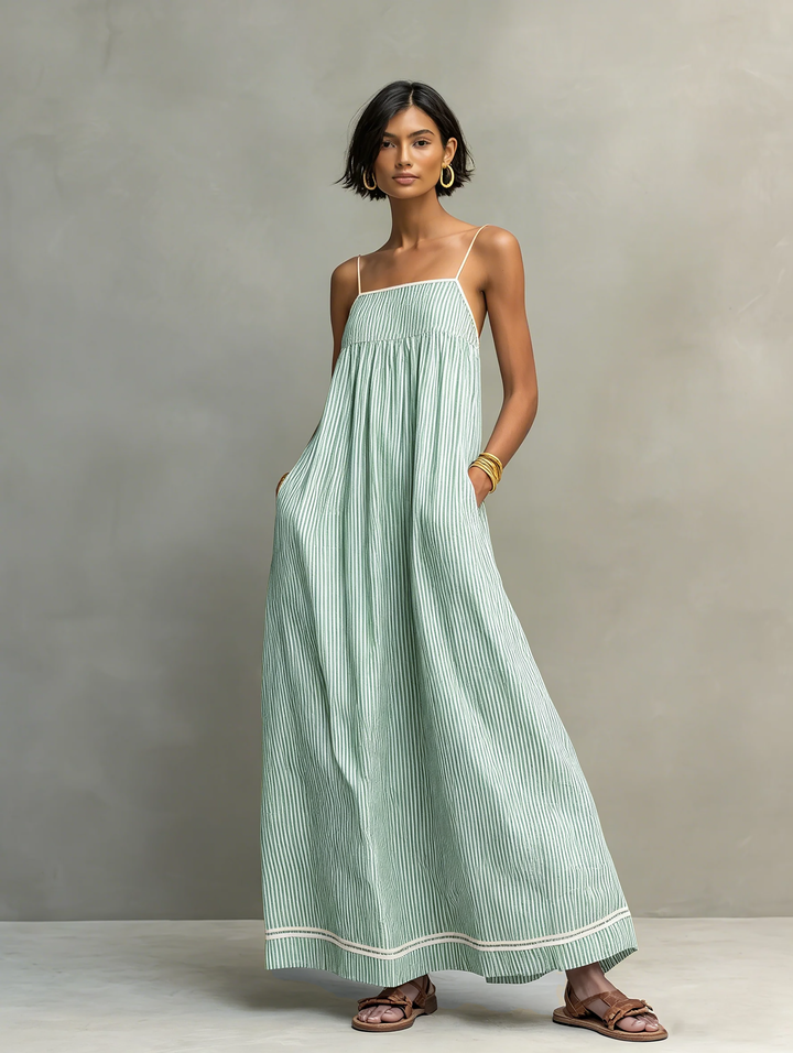 Comfortable women's striped maxi dress, sleeveless with adjustable spaghetti straps, great for sunny days.