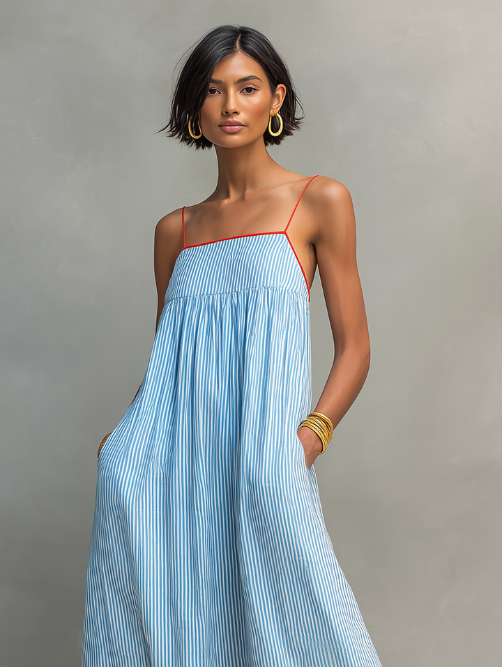 Elegant women's striped long dress, sleeveless with spaghetti straps, perfect for versatile summer fashion.