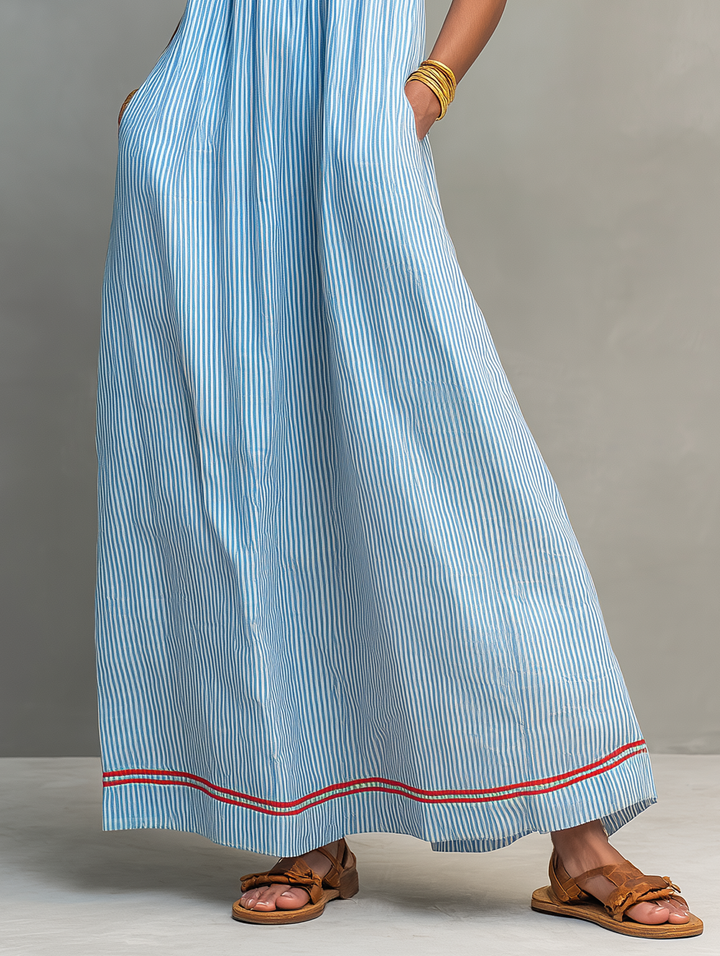 Trendy women's striped maxi dress, spaghetti strap & sleeveless, a chic choice for casual or holiday wear.