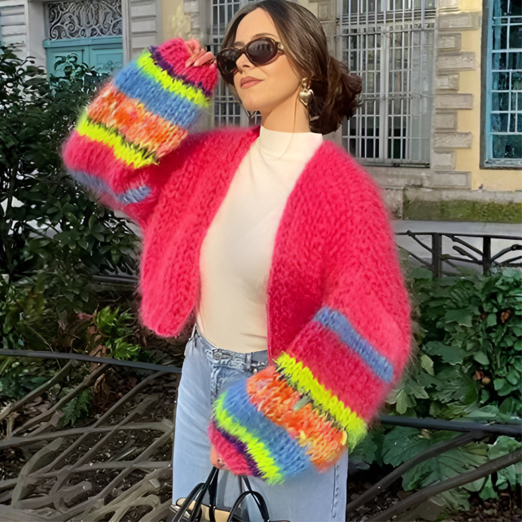 Comfortable women's knitwear cardigan with a stylish striped pattern and open front design.