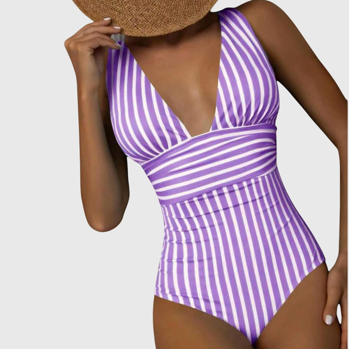Women's one-piece swimsuit with a flattering V-neck and classic stripes, summer poolside style
