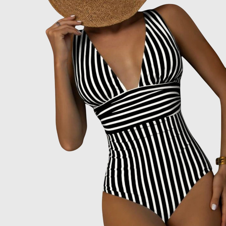 Back view of women's striped one-piece swimsuit, ideal for beach and summer activities