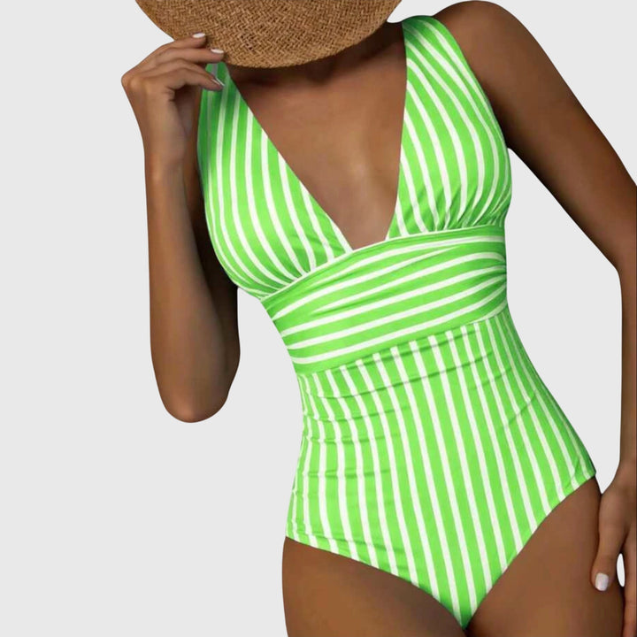 Women's striped one-piece swimsuit with V-neckline, great for a chic poolside look