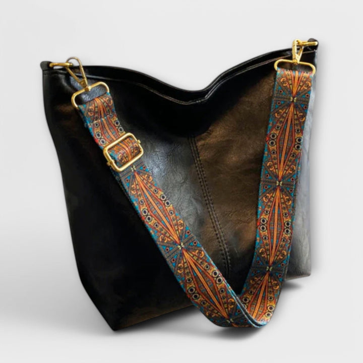 Everyday women's handbag, black, shoulder carry, featuring a distinctive braided strap