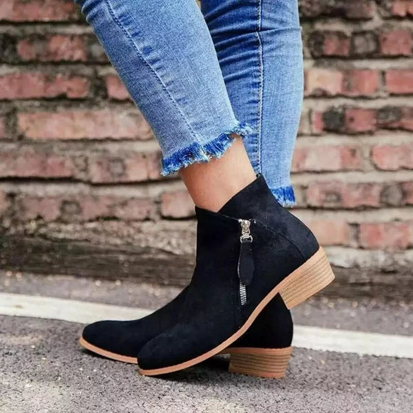 Comfortable women's ankle boots in soft grey suede with easy-access side zipper