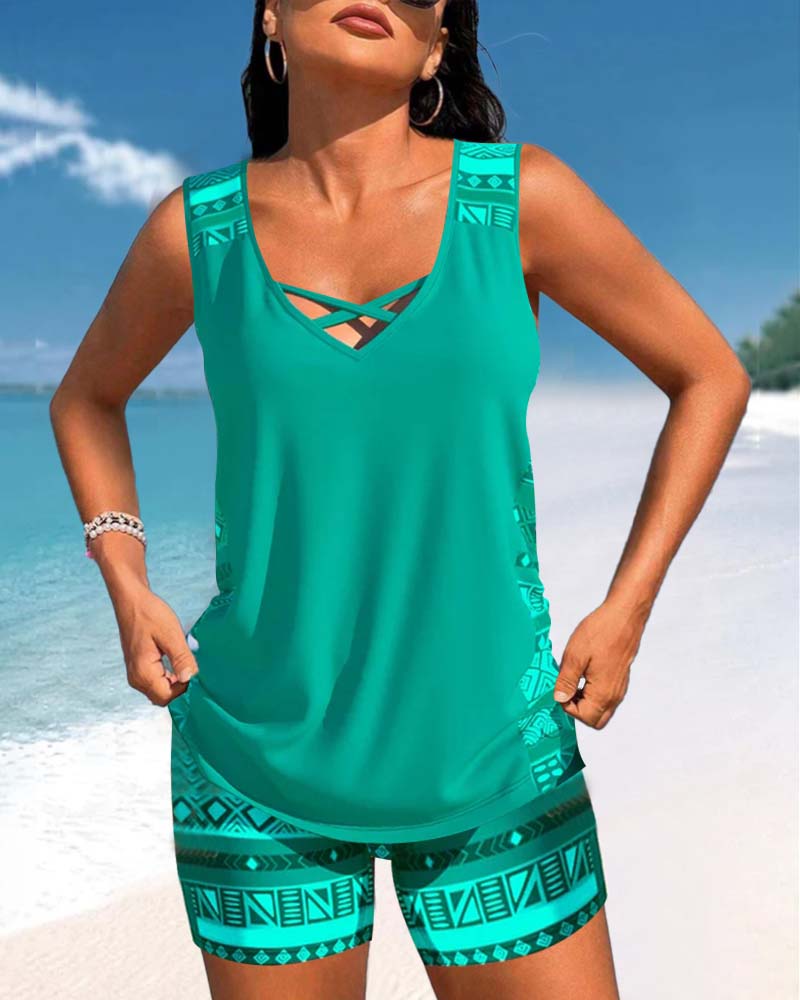 Women's stylish criss-cross tankini swimwear. Two-piece set, perfect for beach, pool, or vacation.