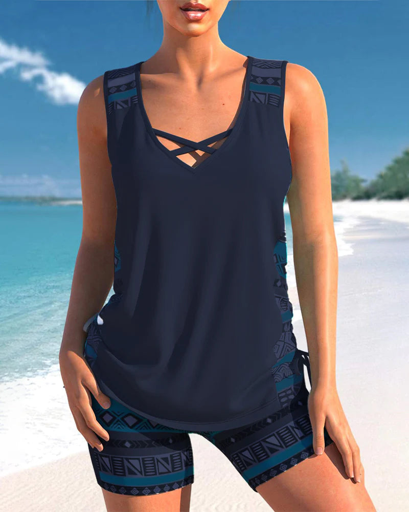 Modern women's criss-cross tankini swimwear. Flattering fit, stylish design, perfect for any vacation.