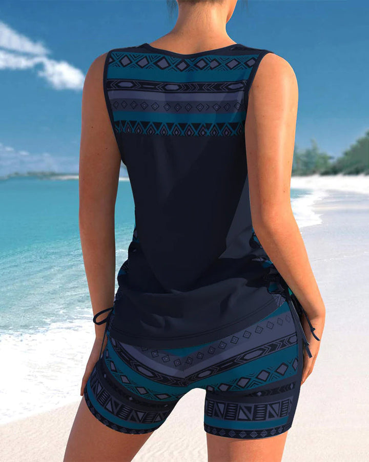 Draped top women's criss-cross tankini swimsuit. Printed, stylish, and perfect for summer beachwear.
