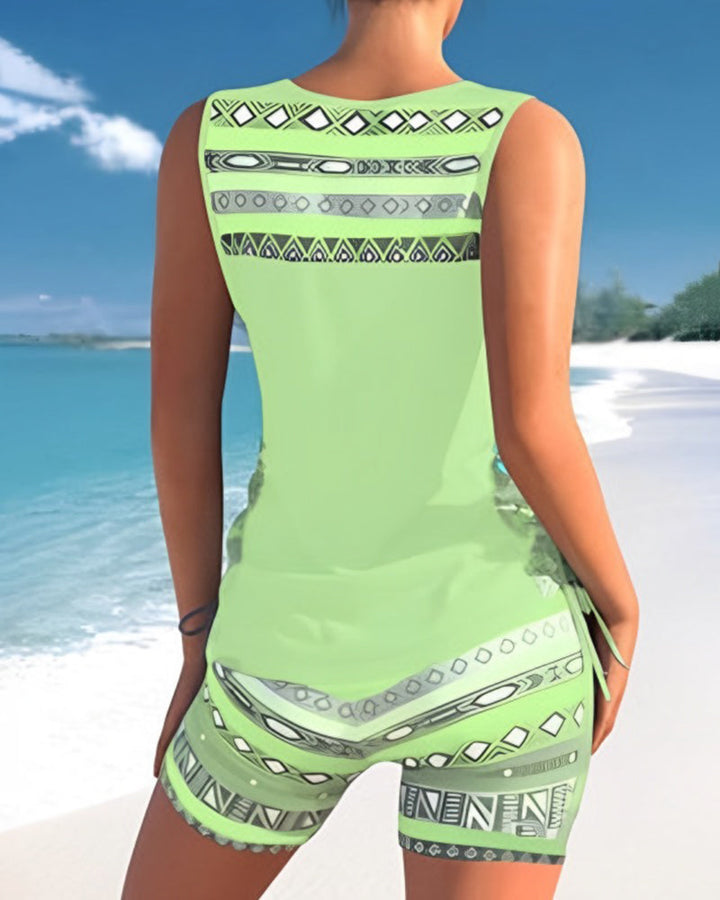Women's Criss Cross Tankini in a vibrant print. Stylish two-piece swimwear for your next vacation.