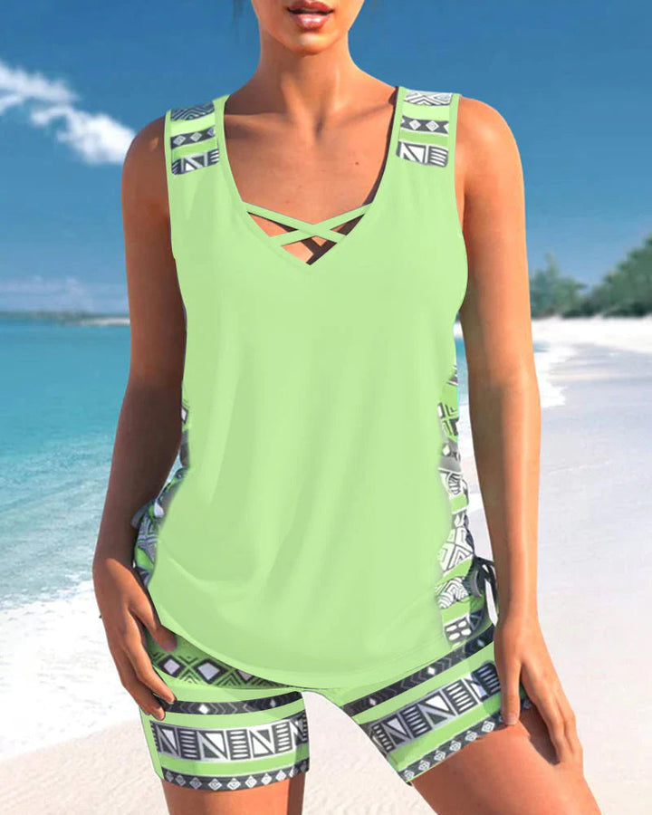 Contemporary women's tankini with a chic criss-cross neckline. Perfect beachwear and summer fashion.