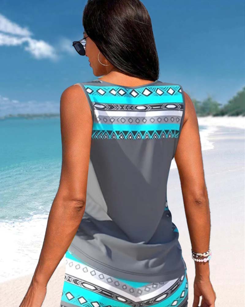 Fashionable women's criss-cross tankini swimsuit. Draped top, full coverage, and chic for summer.