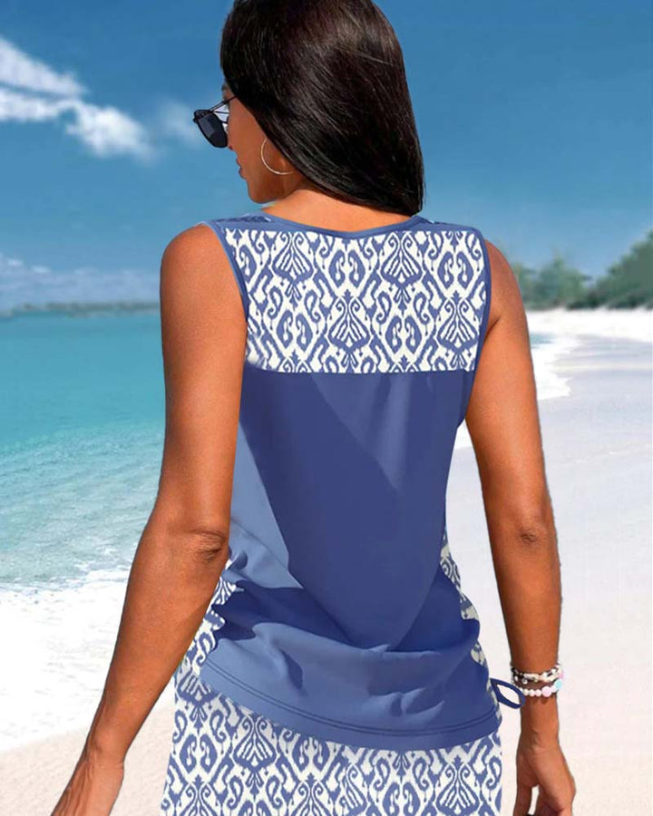 Women's Criss-Cross Tankini: A chic two-piece bathing suit for tropical getaways and poolside fun.