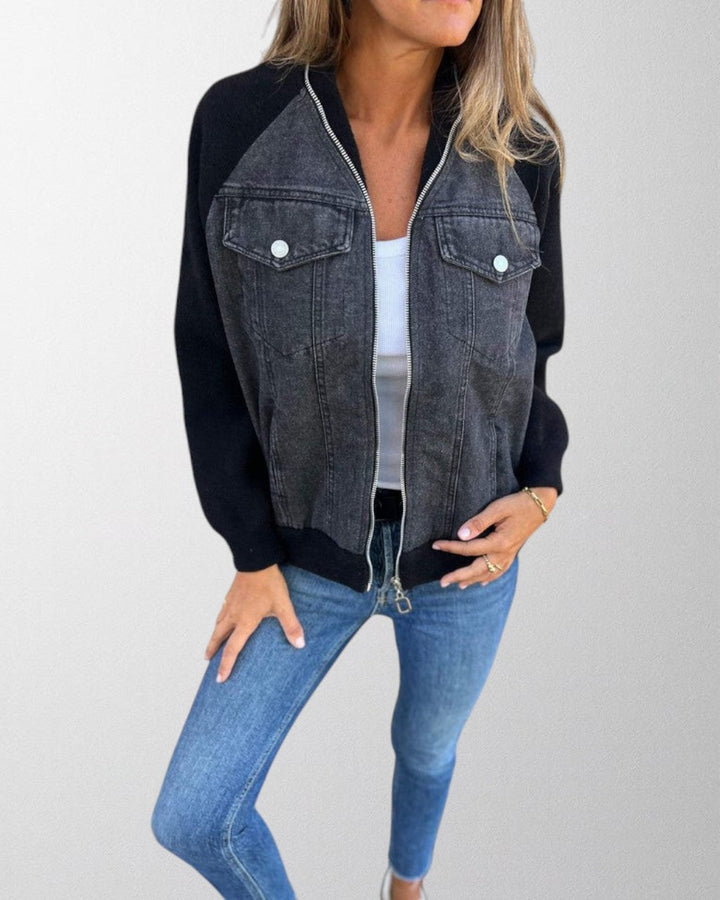 Close-up of a women's fashion denim jacket with unique button detailing, versatile outerwear