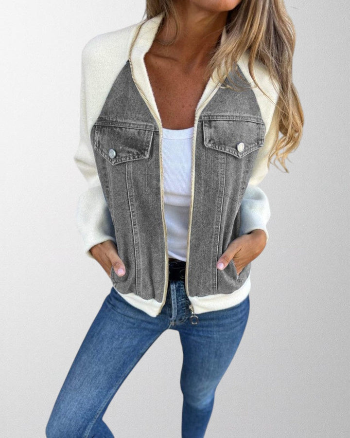 Woman posing in a stylish denim jacket, light blue wash, ideal for everyday fashion