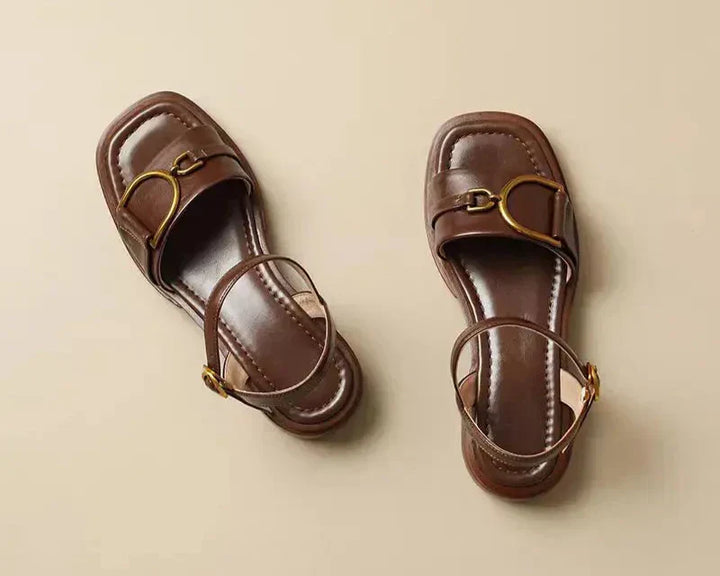 Summer women's flat sandals with distinctive front buckle detail and contemporary square toe