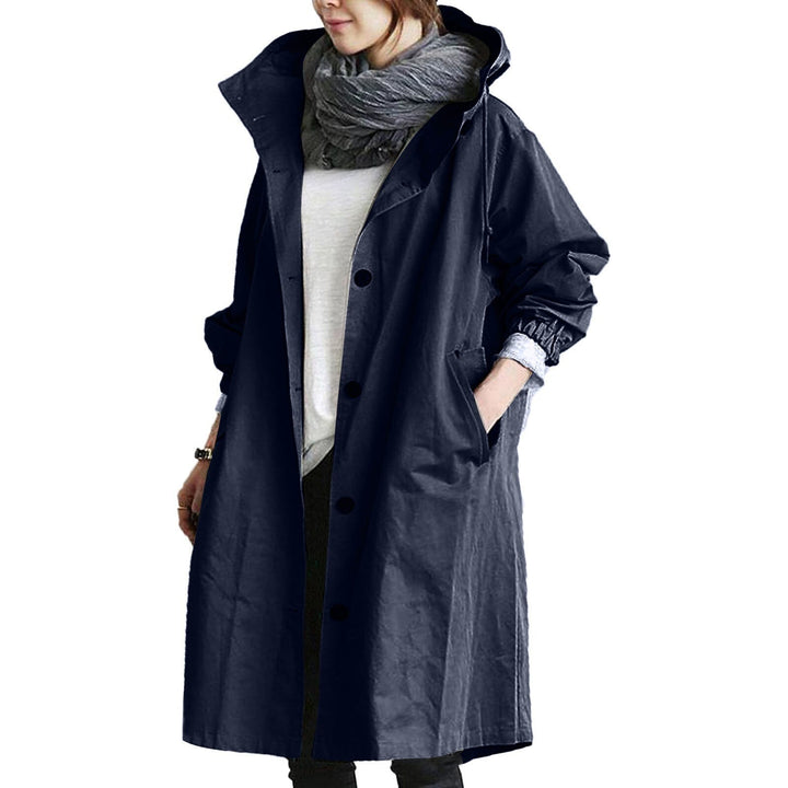 Stylish women's waterproof long coat, a hooded rain jacket suitable for diverse spring/summer outfits.