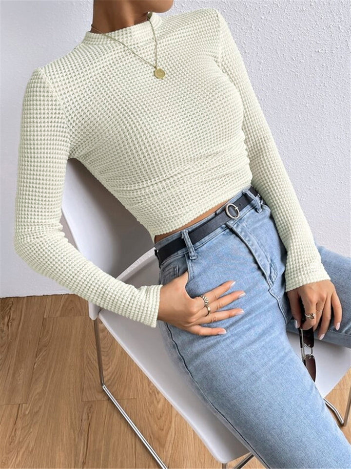 White long sleeve crop top for women, a versatile piece for spring/summer casual wear.