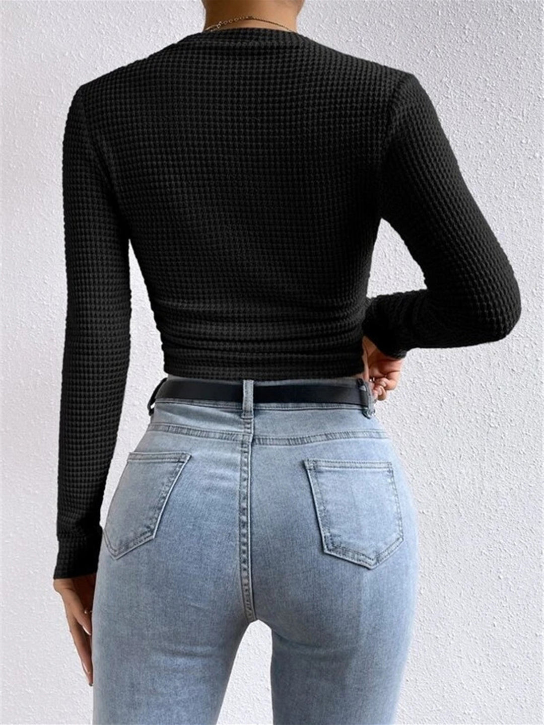 Blue long sleeve crop top for women, offering comfort and style for everyday wear.