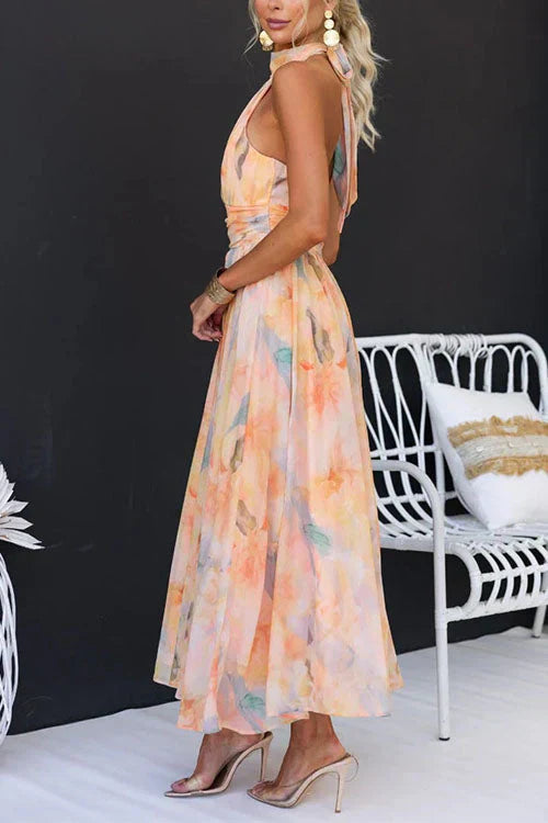 Casual women's summer halter maxi dress featuring a beautiful floral pattern, great for any occasion.