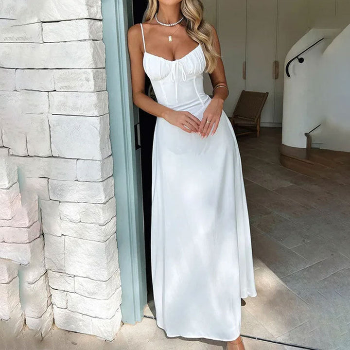 Women's summer sleeveless maxi dress with ruched bodice, perfect for beach or casual wear. Comfortable and elegant.