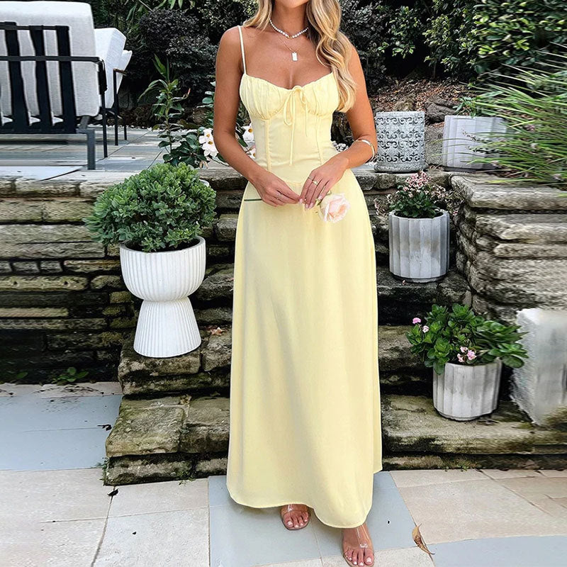 Elegant white sleeveless maxi dress for women, featuring a stylish ruched bodice. Ideal for summer holidays.