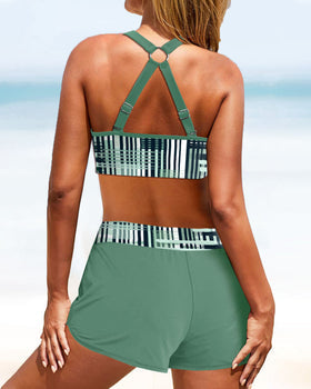 Two-piece women's supportive bikini set with high waist swim shorts. Features a stylish contrast panel.