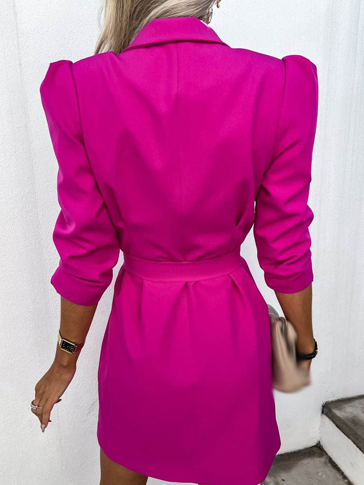Professional women's belted blazer dress. Tailored, double-breasted design for sophisticated workwear or formal occasions.