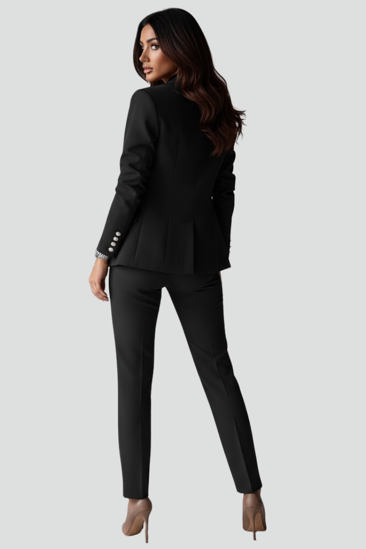 Full body view of a woman wearing a chic tailored blazer and trouser set