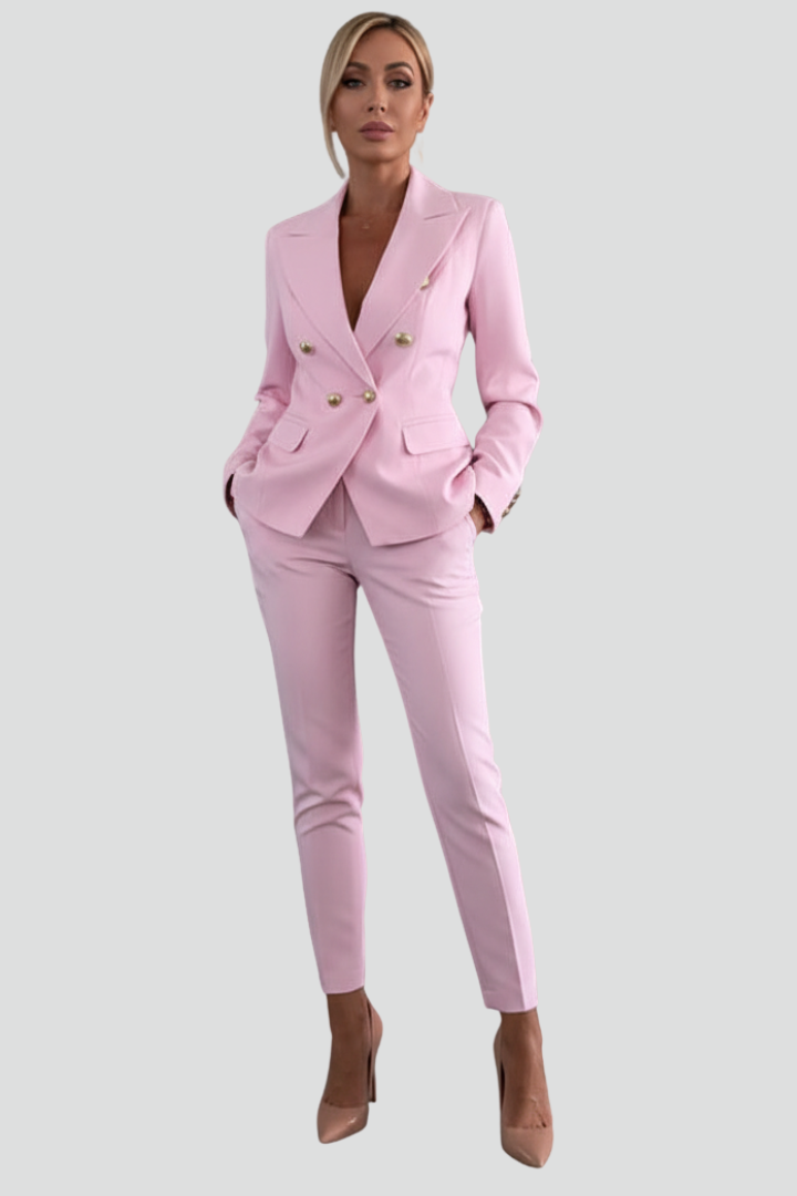 Woman walking confidently in a fashionable tailored blazer and trouser set, business attire