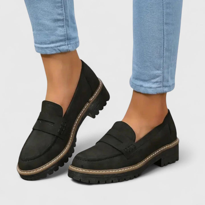Women's tan orthopedic walking loafers with arch support, ergonomic design, and slip-on style for comfort.