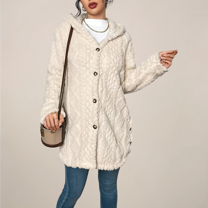 Model wearing a women's textured hooded longline cardigan, full length view, casual outfit.
