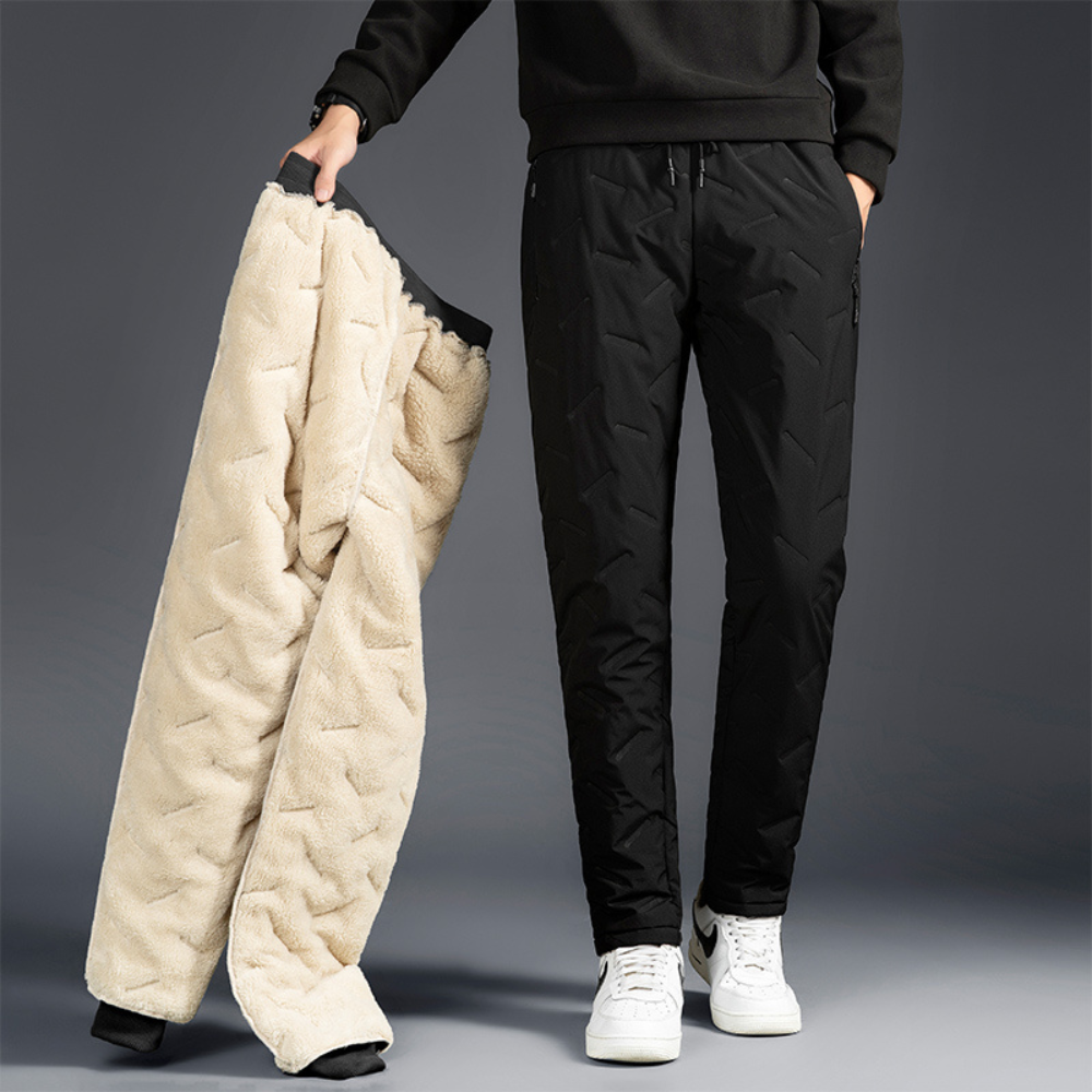 Women's thermal waterproof trousers for winter warmth, ideal for outdoor activities & cold weather.