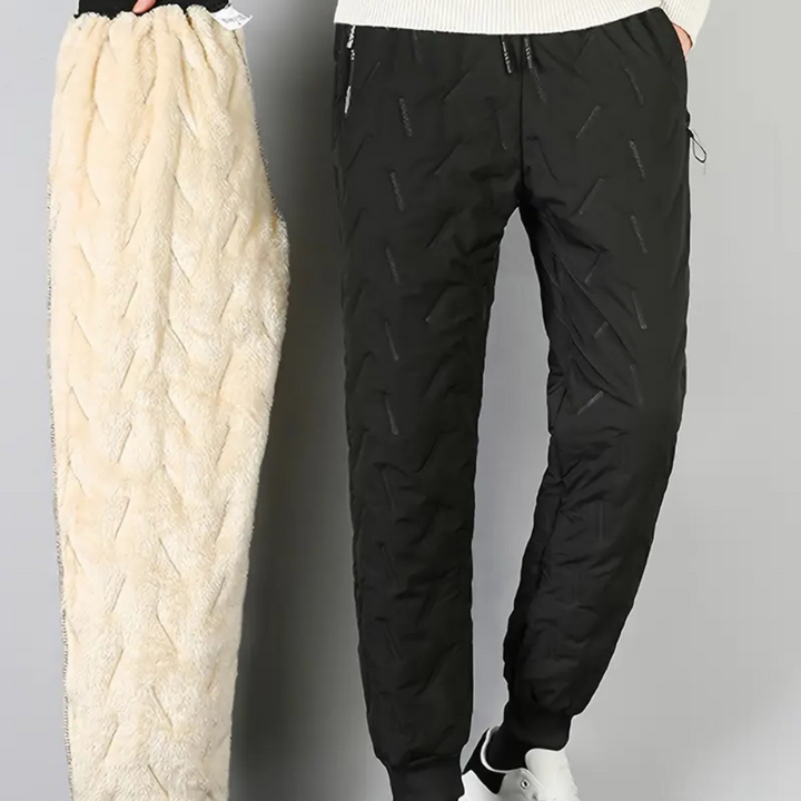 Comfortable women's thermal sweatpants, waterproof and warm for snowy outdoor winter activities.