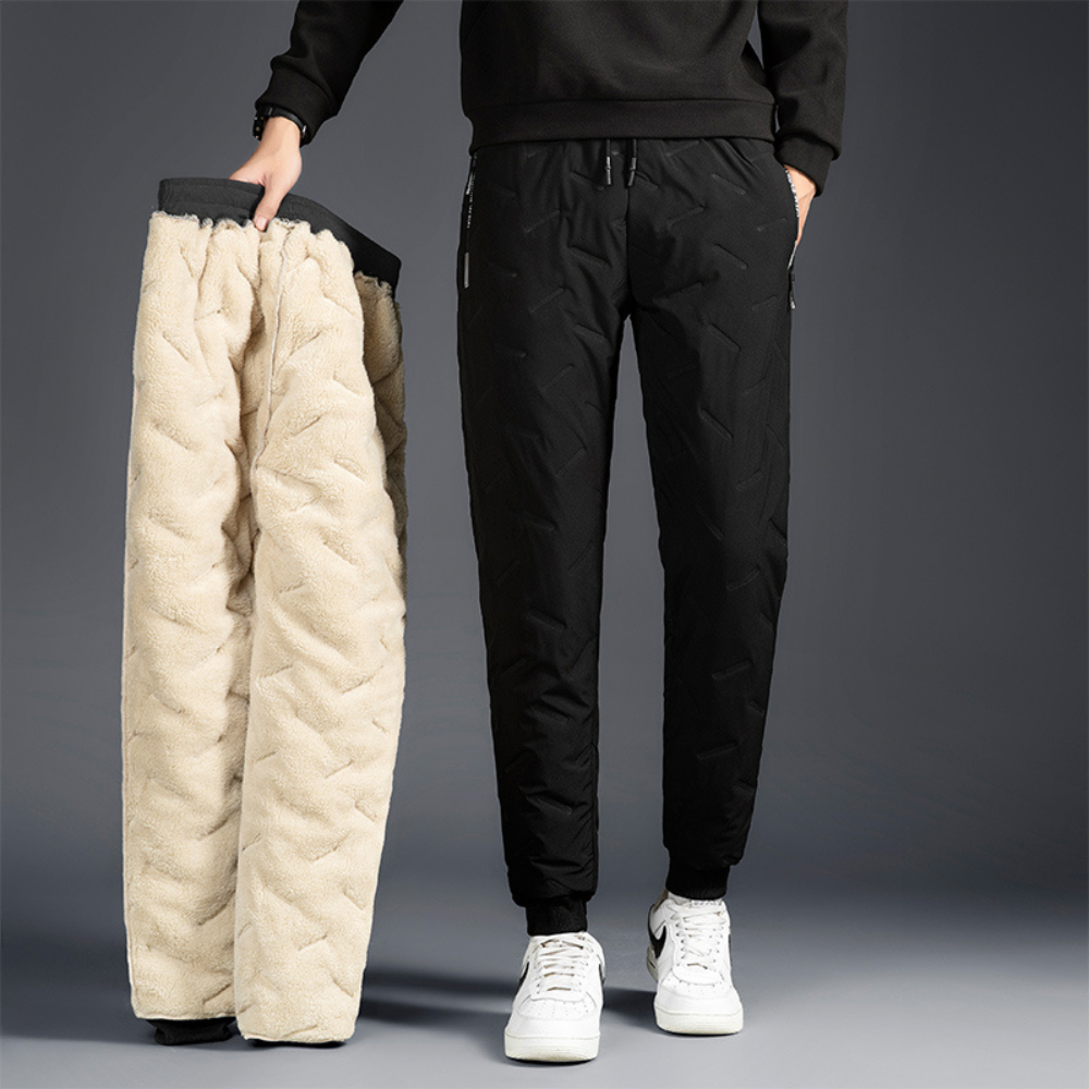 Breathable women's insulated waterproof winter trousers, offering warmth & flexibility for active outdoor use.