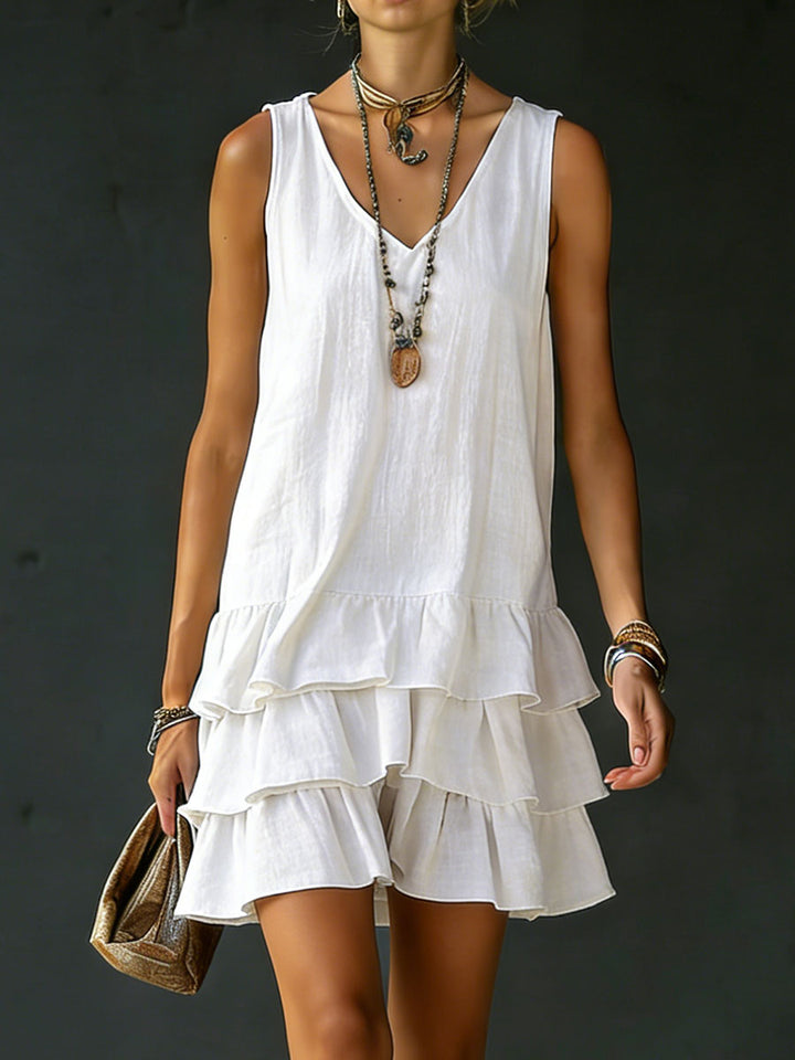 Women's tiered ruffle mini dress with V-neck, perfect for casual summer wear and vacation style.
