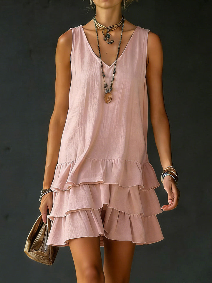 Casual women's summer mini dress with V-neck and tiered ruffles, ideal for vacations and comfortable wear.