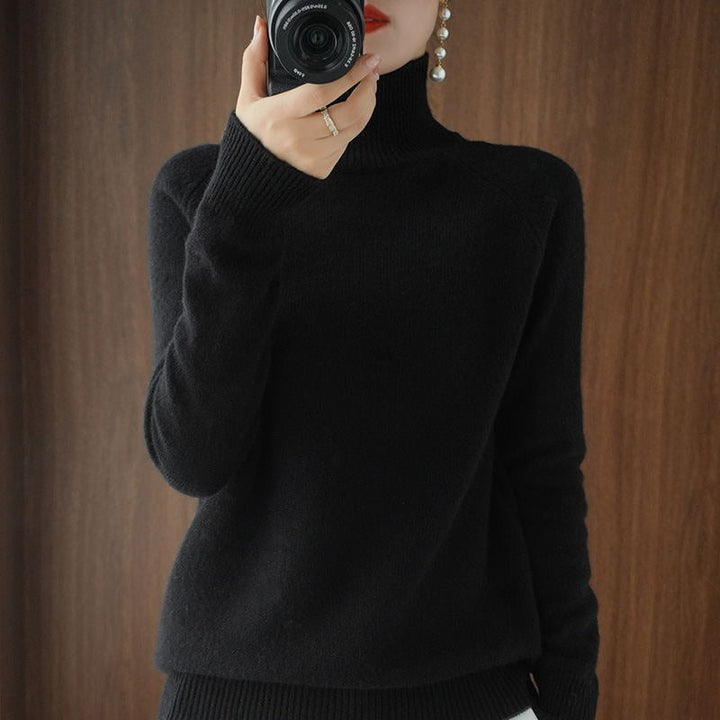 Soft knit women's long sleeve turtleneck sweater, a versatile and comfortable top for minimalist fashion.