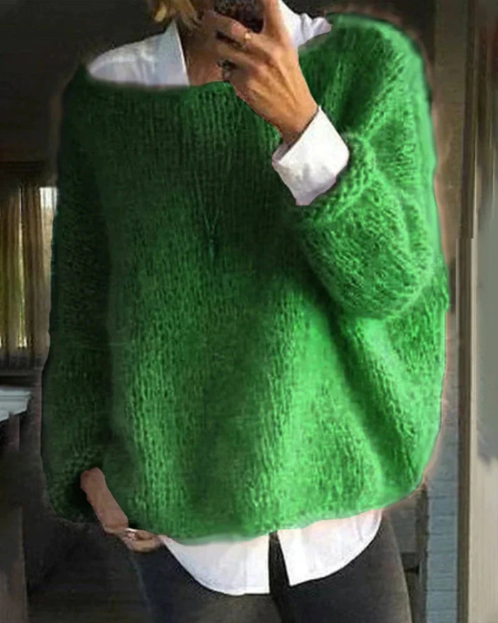 Casual women's long sleeve knit sweater, providing warmth and style for winter.