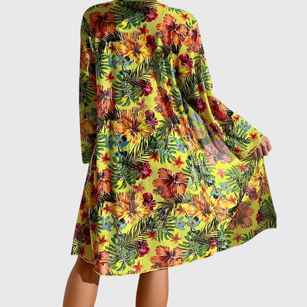 Women's swimsuit with tropical print, including a flattering bikini top and high-rise bottoms.