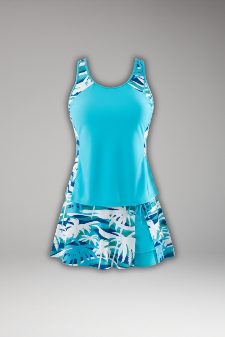 Women's tropical print racerback tankini set with black swim skirt, perfect for beachwear.