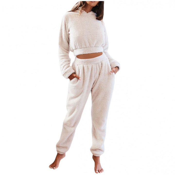 Comfortable women's loungewear set in soft fabric, featuring a long-sleeve hooded top & matching pants.