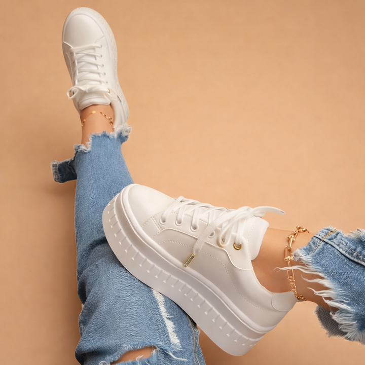 Versatile women's platform sneakers for modern urban style. Fashion-forward, comfortable footwear for any casual occasion.