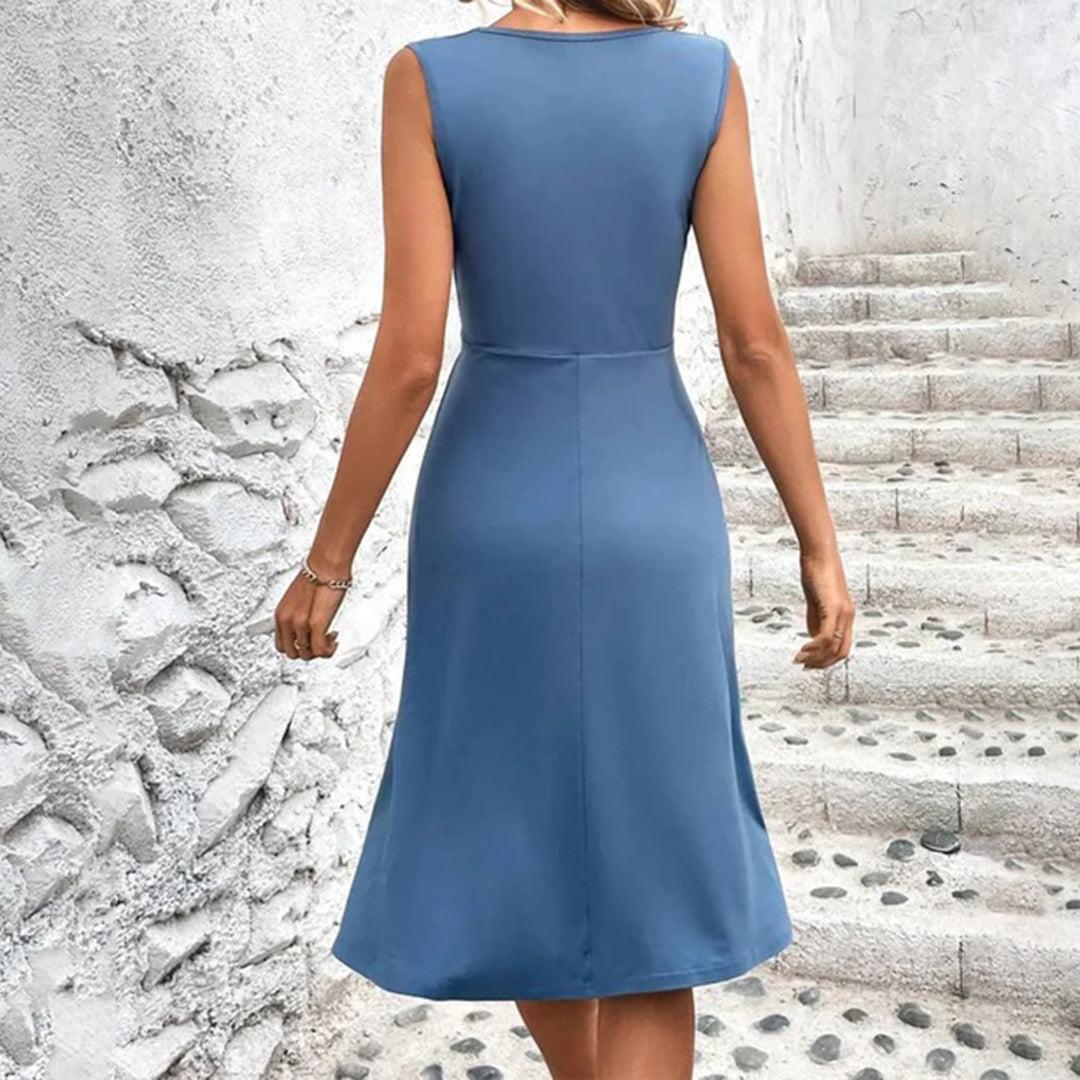 Elegant women's sleeveless V-neck A-line midi dress featuring a stylish print, perfect for summer comfort.